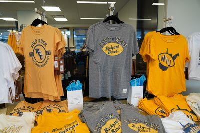 WVU shirts in gold and grey