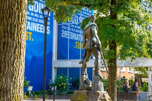 Mountaineer Statue in front of the Mountainlair