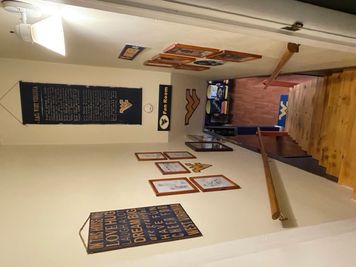 Stairway to basement with WVU swag hanging on walls