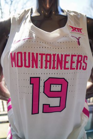 White womens basketball jersey with pink Mountaineers and breast cancer ribbon and number 19