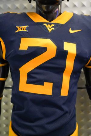 Navy WVU football jersey with the number 21