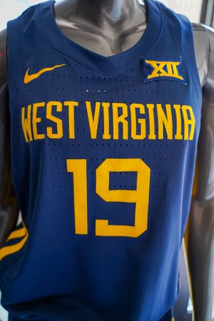 Navy womens basketball jersey with West Virginia and number 33